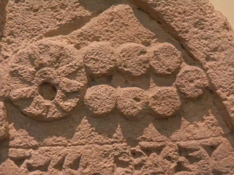 An eight-pointed cross inside a circle engraved on king Sennacherib's stele